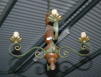 Appraisal: A TURNED WOOD AND WROUGHT IRON CEILING LIGHT