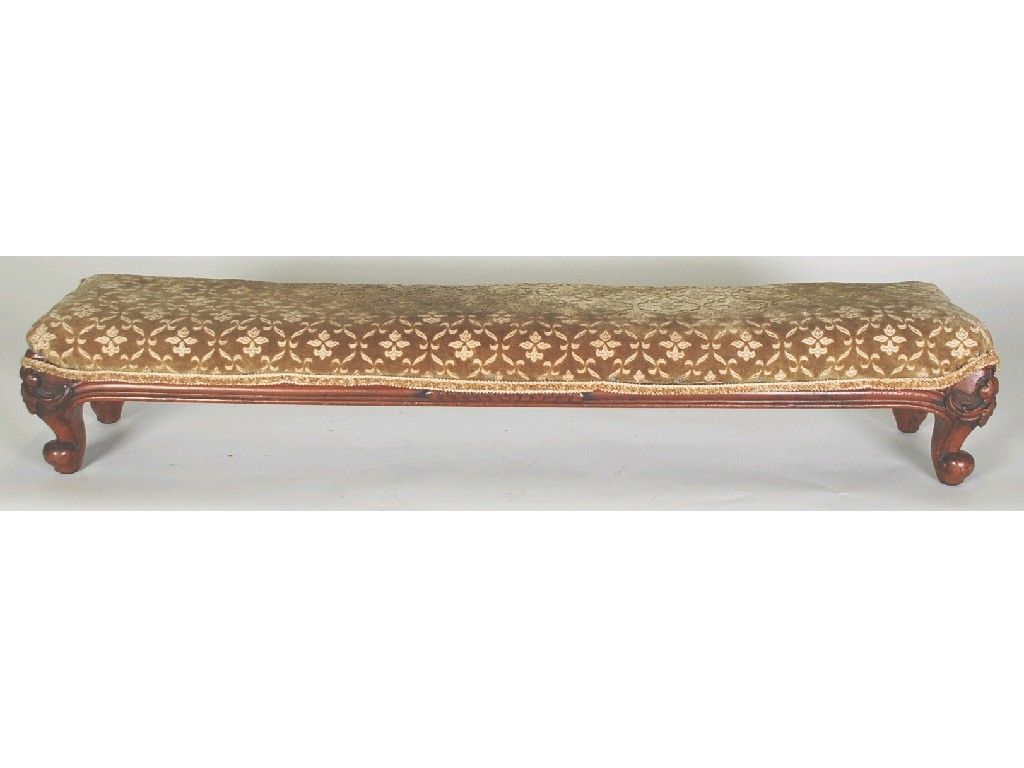 Appraisal: VICTORIAN CARVED WALNUT LONG FOOTSTOOL pale gold upholstered with shewwood