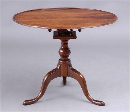 Appraisal: PENNSYLVANIA CHIPPENDALE-STYLE CARVED WALNUT TILT TOP TEA TABLE The dished