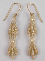 Appraisal: A pair of seed pearl earrings with gold wire fittings