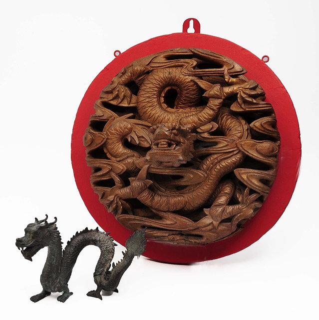 Appraisal: A CHINESE CARVED WOOD DRAGON'S HEAD circa mounted on a