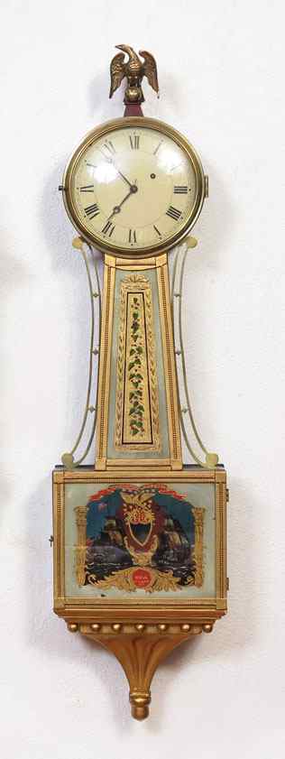 Appraisal: REVERSE PAINTED USS CONSTITUTION BANJO CLOCK Cast eagle finial mahogany