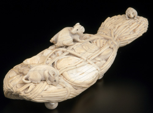 Appraisal: JAPANESE IVORY Carved okimono of sheafed reeds encasing fish and