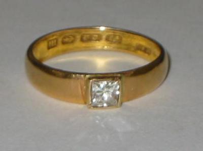 Appraisal: A SOLITAIRE DIAMOND RING the princess cut stone approximately cts