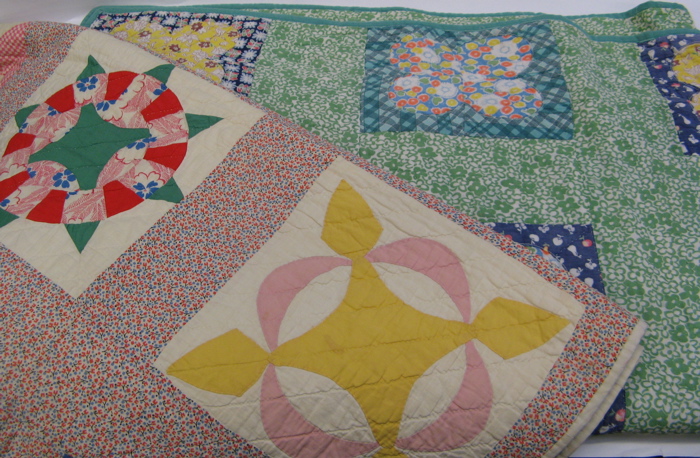 Appraisal: TWO AMERICAN PIECED HANDMADE QUILTS the first in a floral