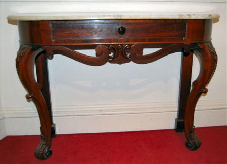 Appraisal: A Victorian mahogany and white marble topped console table the