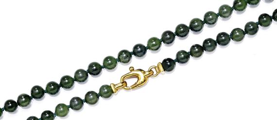 Appraisal: A NEPHRITE SAUTOIR AND NECKLACE Yellow gold clasps Decorative sautoir