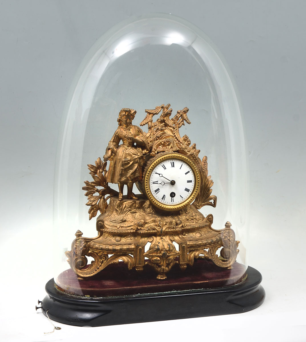 Appraisal: GILT FIGURAL CLOCK UNDER DOME GLASS Gilt metal clock under