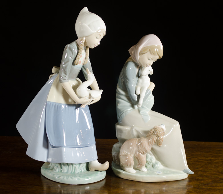 Appraisal: TWO LLADRO PORCELAIN FIGURINES Jealousy by sculptor Juan Huerta issued