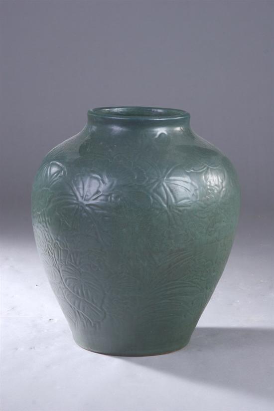 Appraisal: JAPANESE GREEN STONEWARE JAR Meiji period Molded with floral decoration