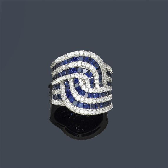 Appraisal: A SAPPHIRE AND DIAMOND RING White gold Broad band ring