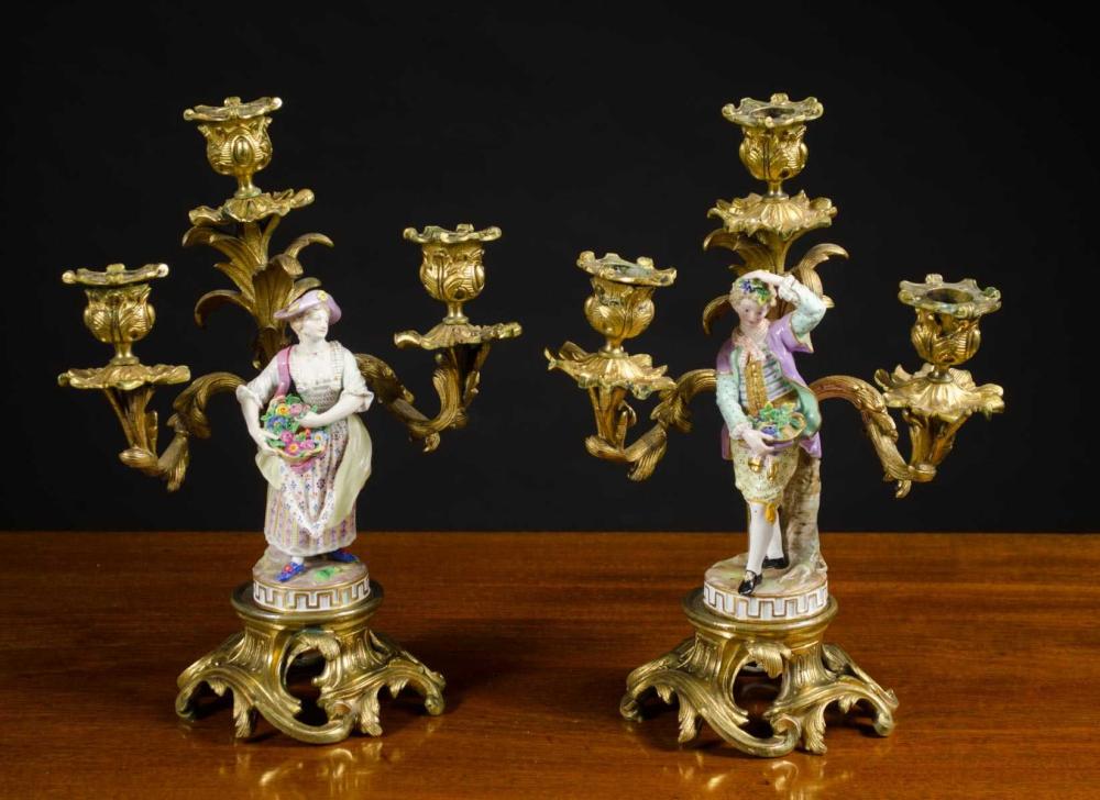 Appraisal: MEISSEN ATTRIBUTED PORCELAIN AND GILT METAL CANDELABRA pair of hand