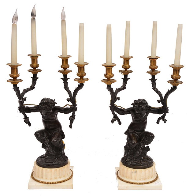 Appraisal: A PAIR OF FRENCH BRONZE AND ORMOLU FOUR BRANCH CANDELABRA