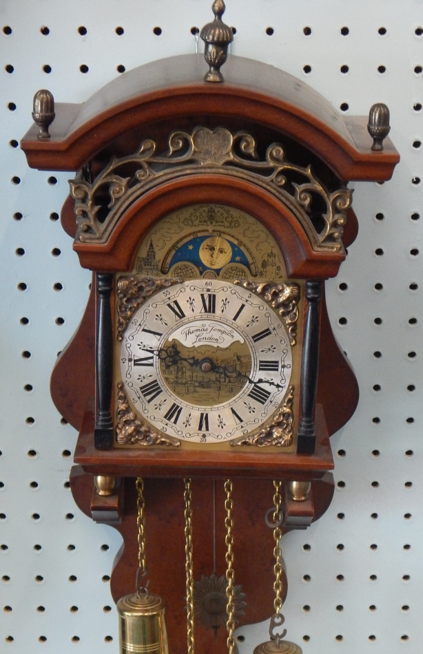 Appraisal: A reproduction mahogany wall clock the dial stamped Thomas Tompion