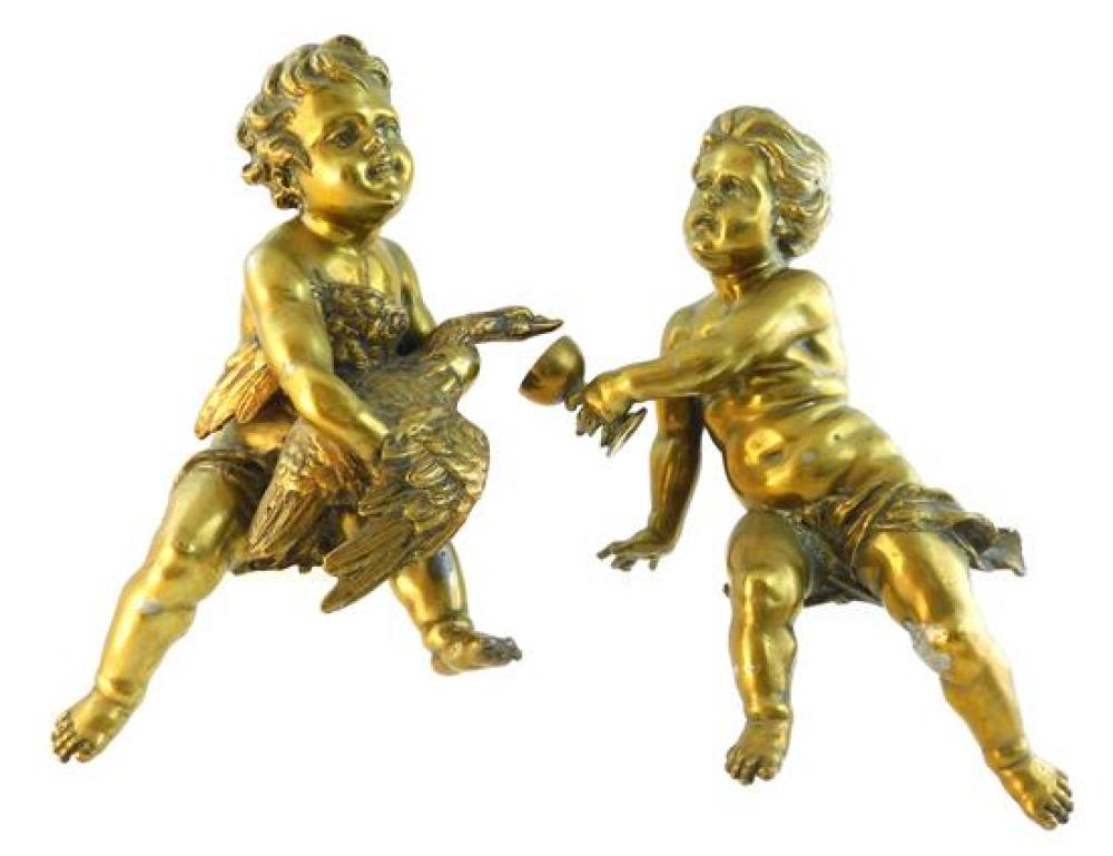 Appraisal: Pair of seated brass putti figures one with goblet h