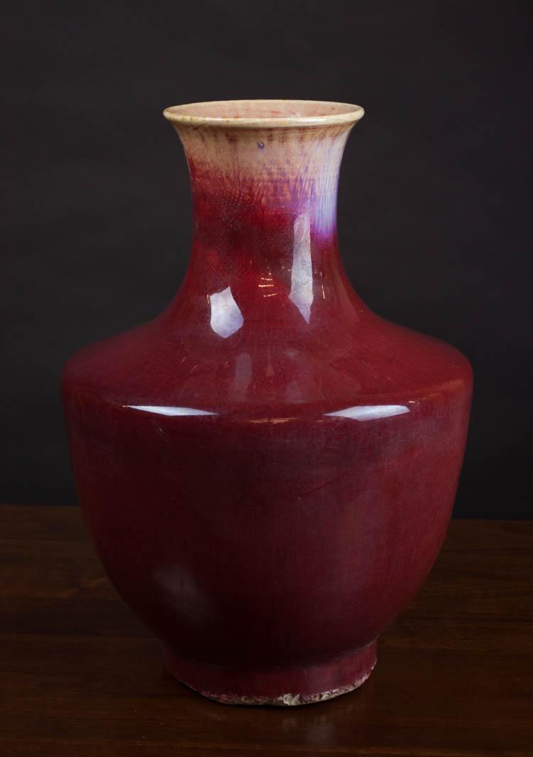 Appraisal: CHINESE FLAMBE GLAZED PORCELAIN VASE with wide shoulders tapered base