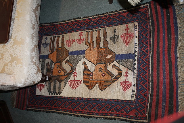 Appraisal: A SMALL EASTERN WOOL RUG with stylised animal decoration cm