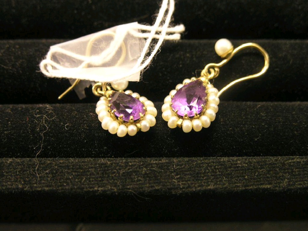 Appraisal: A pair of amethyst and seed pearl ear-rings on yellow