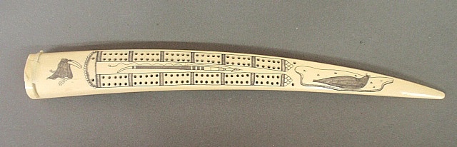 Appraisal: - Inuit carved walrus tusk cribbage board th c with