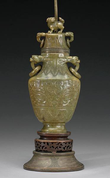 Appraisal: A green hardstone covered vase The olive green matrix of