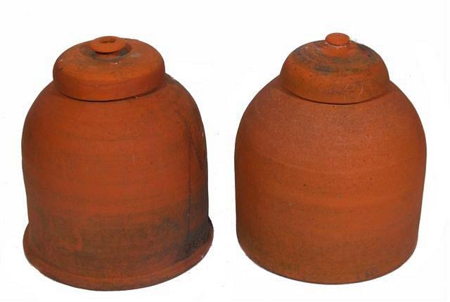 Appraisal: A PAIR OF TERRACOTTA RHUBARB FORCERS of globe form with