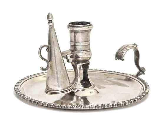 Appraisal: An English Silver Chamberstick Alexander Johnston London of circular form