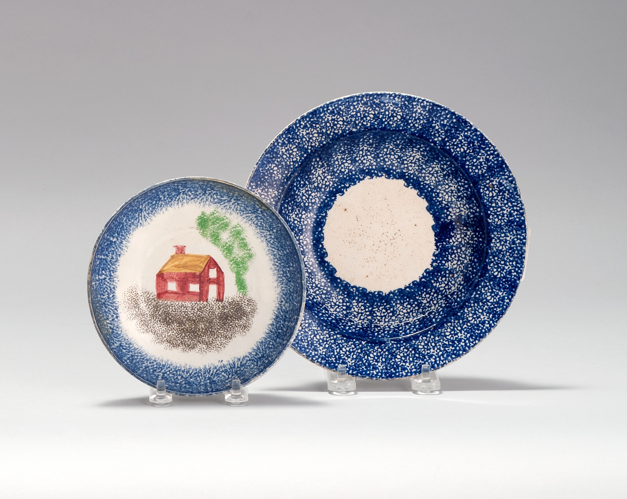 Appraisal: TWO SPATTERWARE POTTERY BOWLS th CenturyOne with primitive multicolor decoration