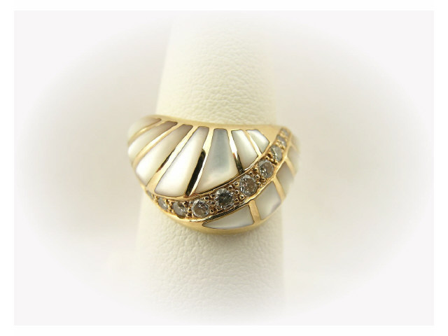 Appraisal: K yellow gold custom mother-of-pearl and diamond ring containing ten