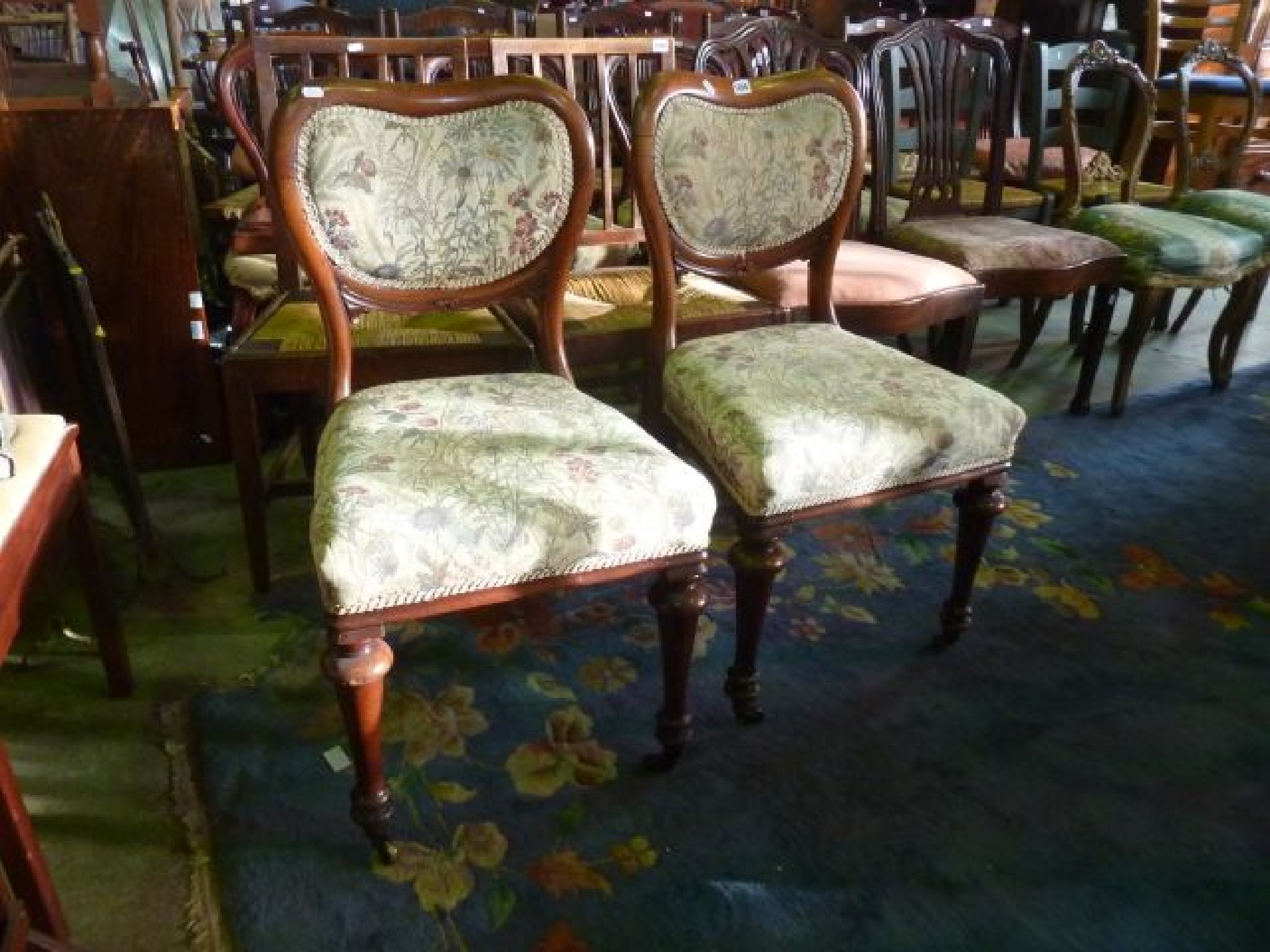 Appraisal: A pair of mid Victorian balloonback dining chairs upholstered seats