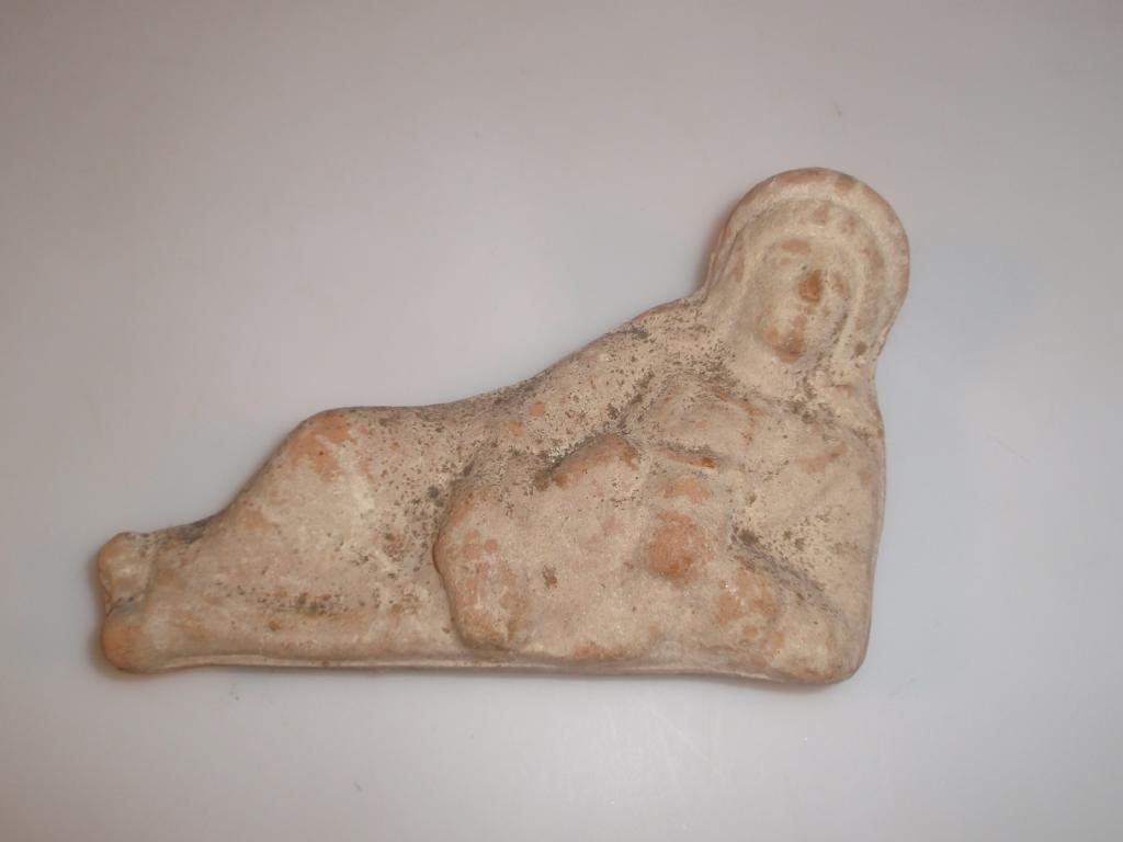 Appraisal: A Hellenistic hollow moulded terracotta statuette of a reclining female