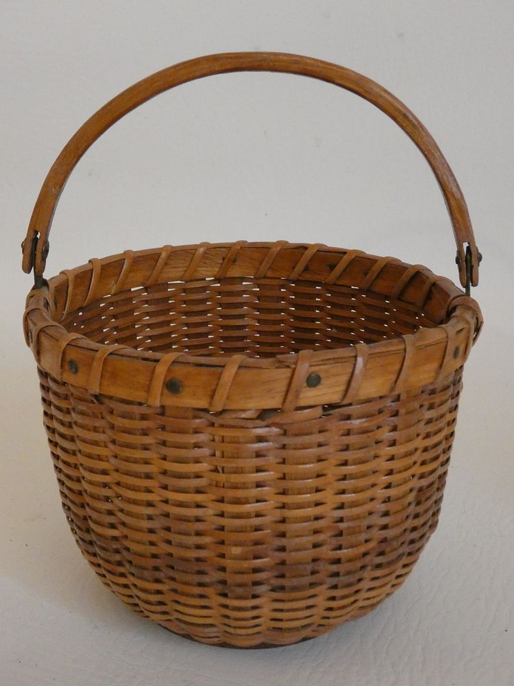 Appraisal: ANTIQUE NANTUCKET BASKET Mid th century Nantucket small lightship basket