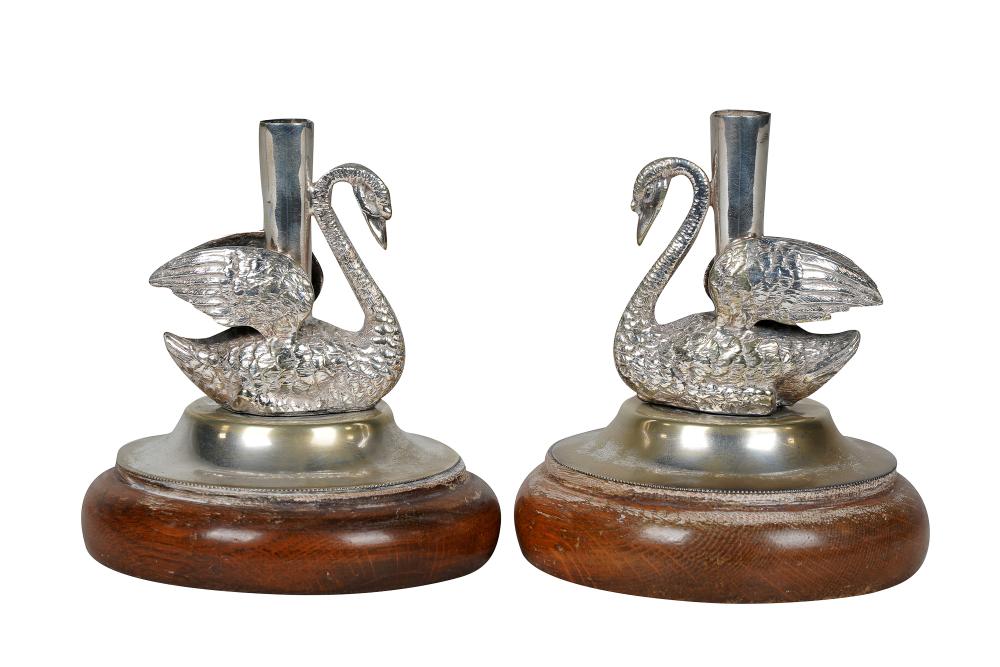 Appraisal: PAIR OF SILVERPLATE SWAN-FORM CANDLESTICKSwith British silverplate marks mounted to