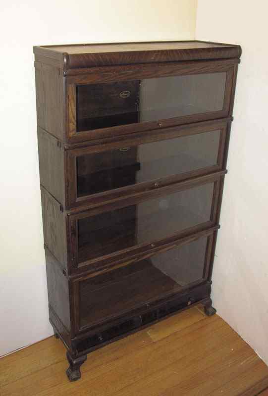 Appraisal: MACEY OAK STACK BARRISTERS BOOKCASE Four metal banded sections graduating