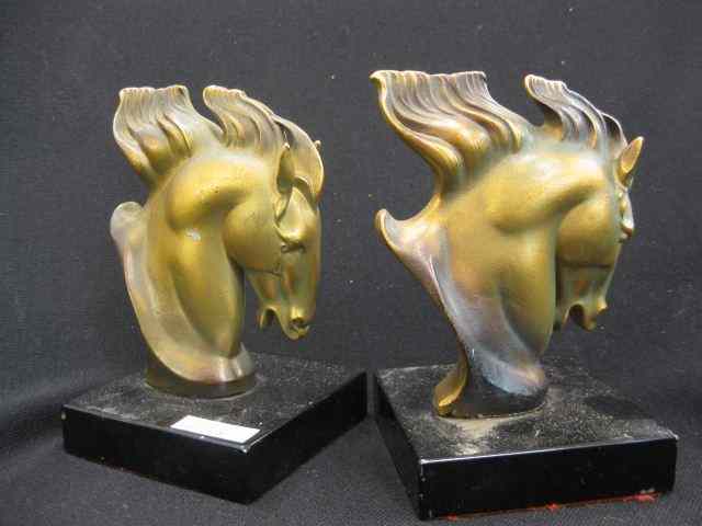 Appraisal: Pair of Bronzed Deco Horsehead Bookends black marble base ''