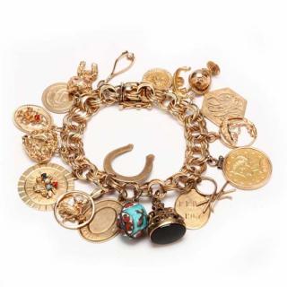 Appraisal: KT Charm Bracelet with Charms the bracelet with charms to