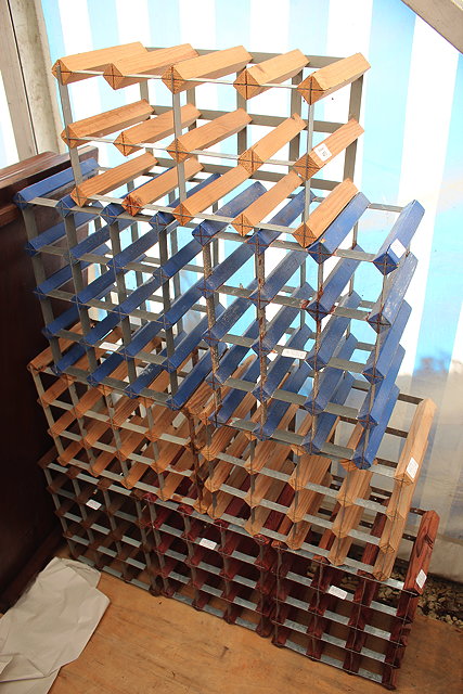 Appraisal: A GROUP OF SEVEN BOTTLE WINE RACKS together with a