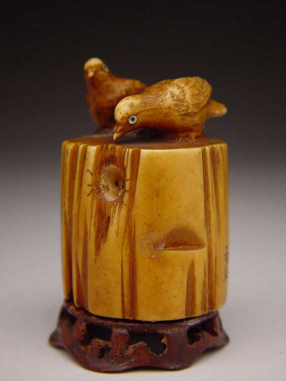 Appraisal: CARVED STAG ANTLER NETSUKE Carved and stained stag antler netsuke