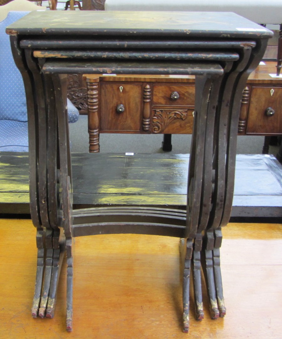 Appraisal: A nest of four chinoiserie decorated occasional tables on lyre