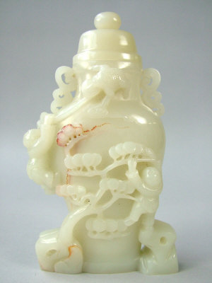 Appraisal: A Chinese white jade vase and cover of compressed baluster