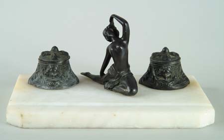 Appraisal: FIGURAL METAL AND MARBLE INKSTAND Two shaped hinged lid inkwells