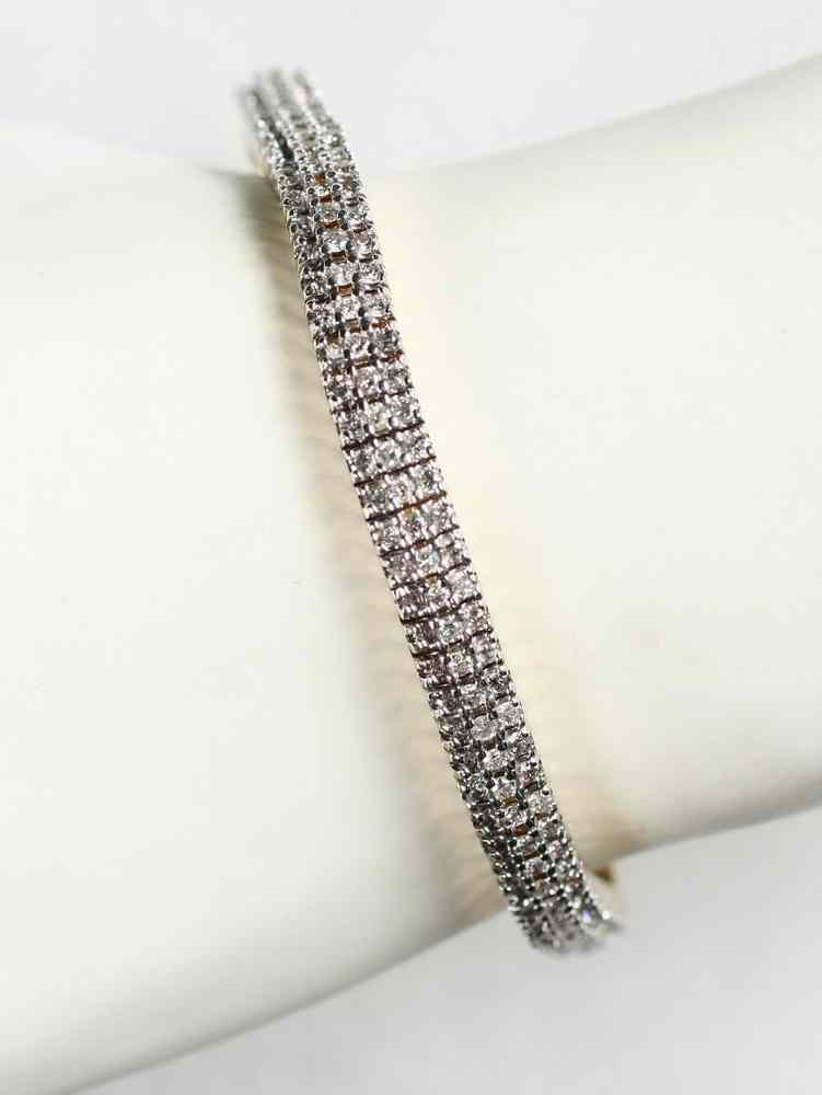 Appraisal: BRACELET - K yellow gold and diamond line bracelet approx