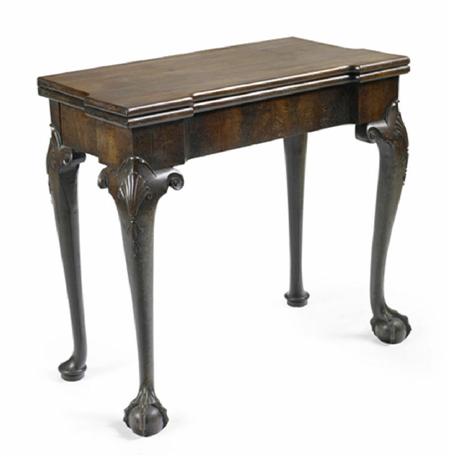 Appraisal: A George II mahogany foldover table the top of inverted