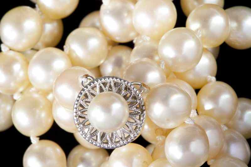 Appraisal: Double Strand Pearl Necklaceconsisting of - mm off white pearls