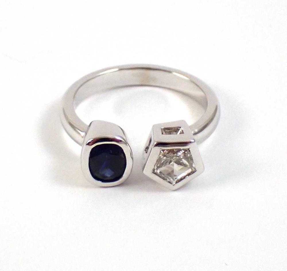 Appraisal: DIAMOND BLUE SAPPHIRE AND FOURTEEN KARAT WHITE GOLD RING bezel