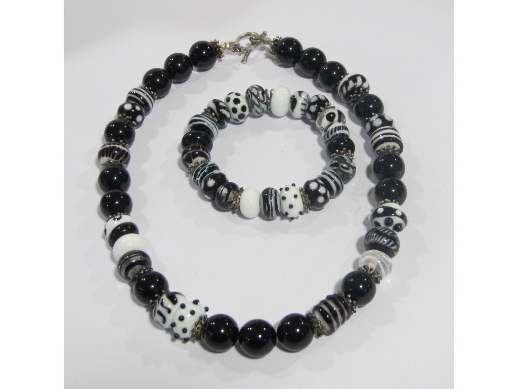 Appraisal: Contemporary Italian glass beads in black and white comprising necklace