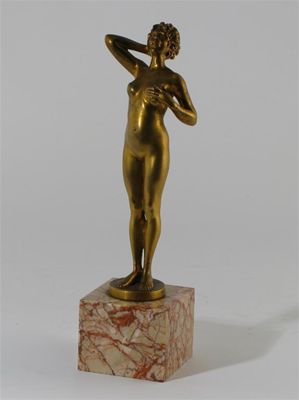 Appraisal: A gilt bronze figure of a erotic woman cast from