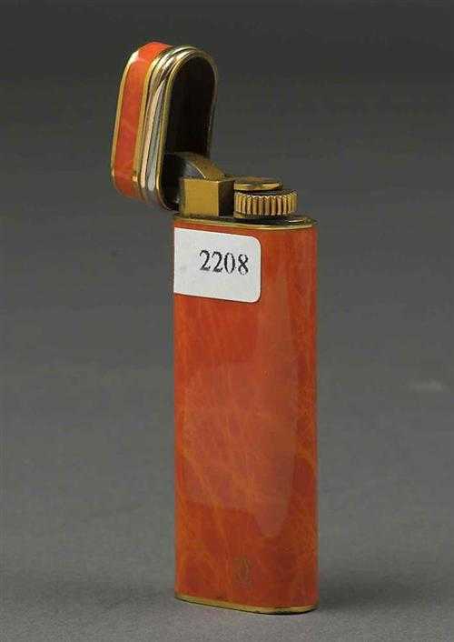 Appraisal: LIGHTER CARTIER Lacquered gas lighter with a brown-orange marbled housing