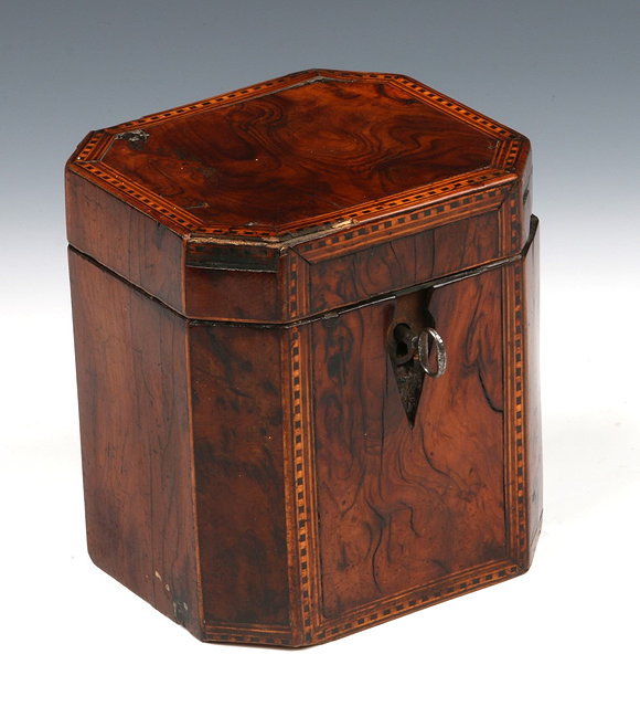 Appraisal: A GEORGE III YEW WOOD TEA CADDY of eight sided