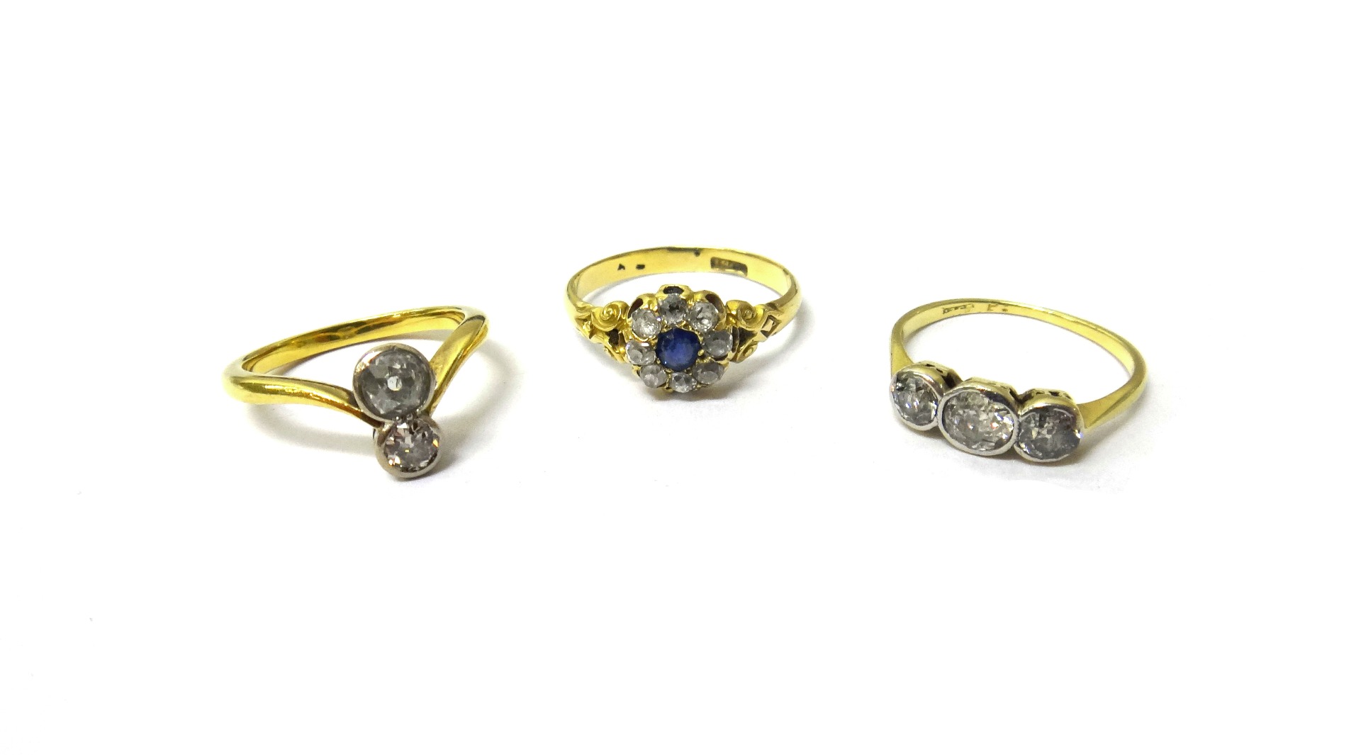 Appraisal: A gold and diamond set two stone ring mounted with