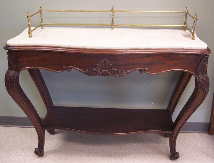 Appraisal: Carved walnut Victorian server with later brass gallery w h